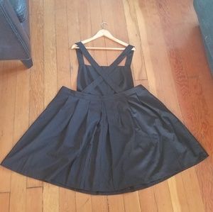 Black, pleated romper skirt.